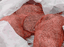 Pink red netting in plastic bag
